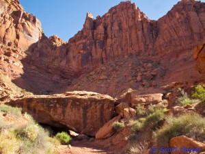 If hikers reach this giant boulder laying across the main wash they have passed the wash exit point by 120 yards.