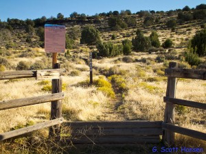 This stepover leads to the single-track trail