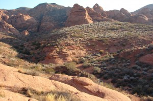 Arch lies beyond small peak.