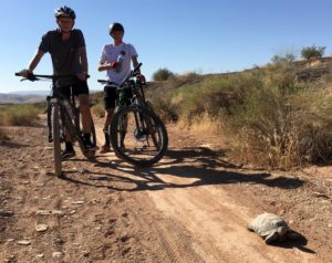 Two mountain bike cyclists take a break on the Bear Claw Poppy trail